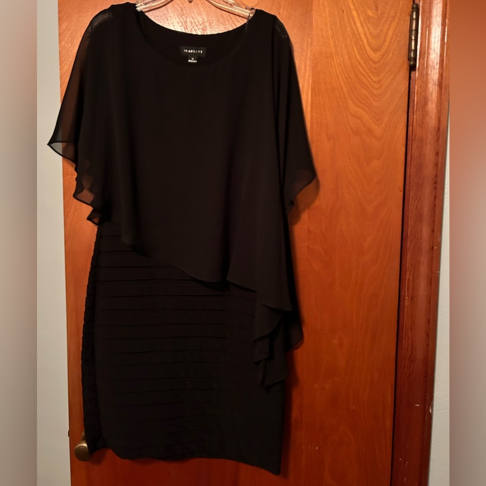 Beautiful dress. Size 12 but fits like a size 10.